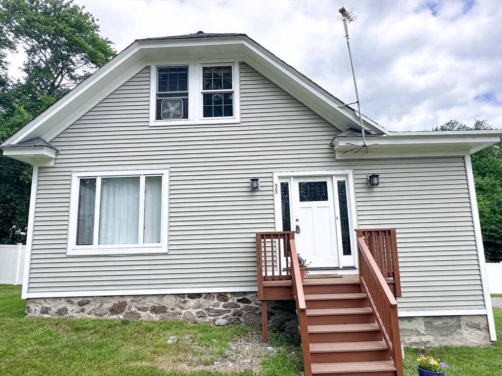 35 Parham Road Tyngsboro, MA 01879 - Photo 1 of 42 a front view of a house with a yard
