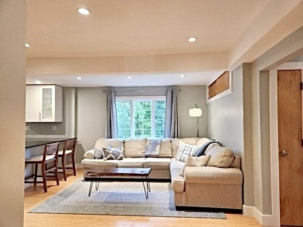 35 Parham Road Tyngsboro, MA 01879 - Photo 14 of 42 a living room with furniture and a large window