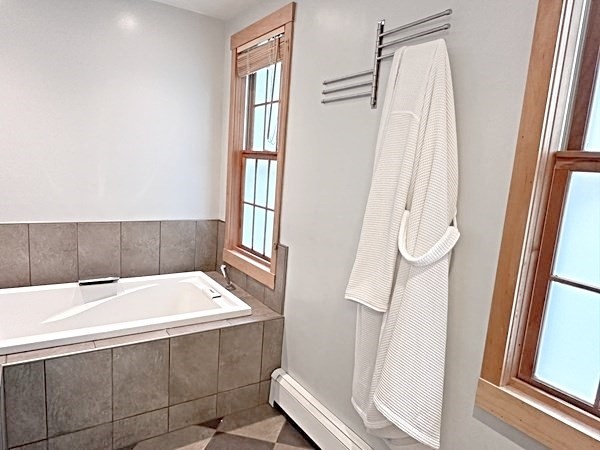 35 Parham Road Tyngsboro, MA 01879 - Photo 18 of 42 a bathroom with a bathtub and a window