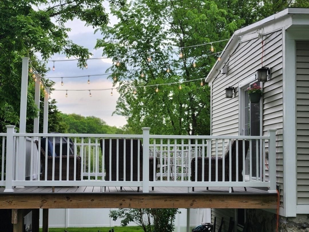 35 Parham Road Tyngsboro, MA 01879 - Photo 36 of 42 a view of a wooden roof deck