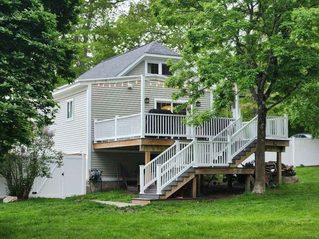 35 Parham Road Tyngsboro, MA 01879 - Photo 38 of 42 a view of house with a yard deck and slide