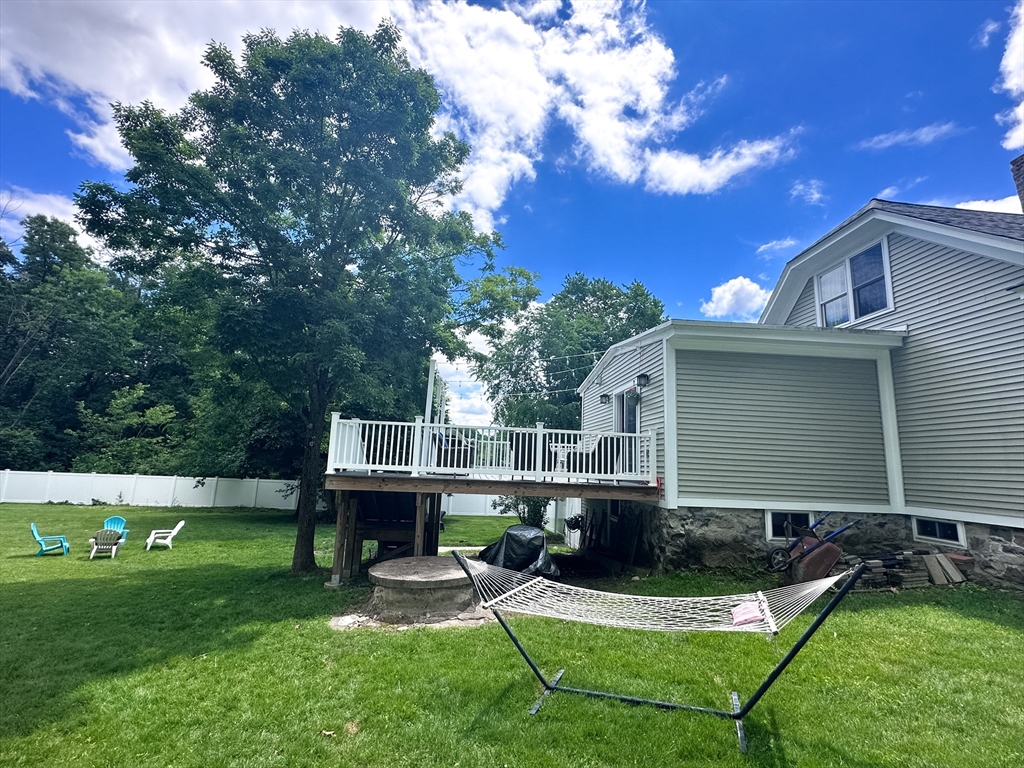 35 Parham Road Tyngsboro, MA 01879 - Photo 41 of 42 a front view of house with yard and green space