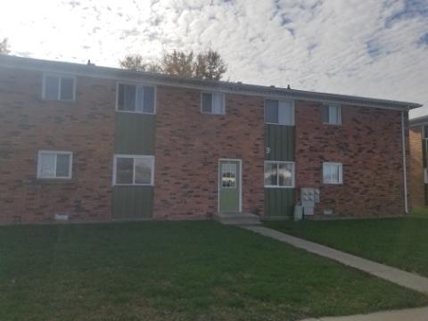 205 Sandra Avenue, Unit L2 Mendota, IL 61342 - Photo 1 of 6 a brick building with a yard
