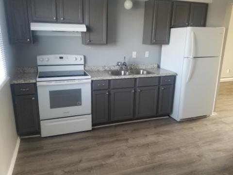 205 Sandra Avenue, Unit L2 Mendota, IL 61342 - Photo 2 of 6 a kitchen with cabinets a refrigerator and a stove