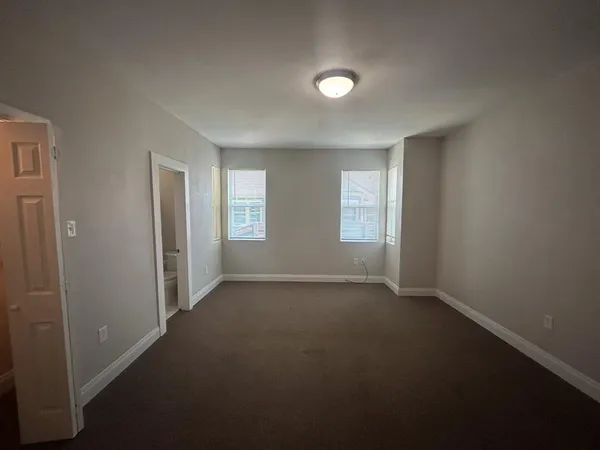 a view of empty room with windows