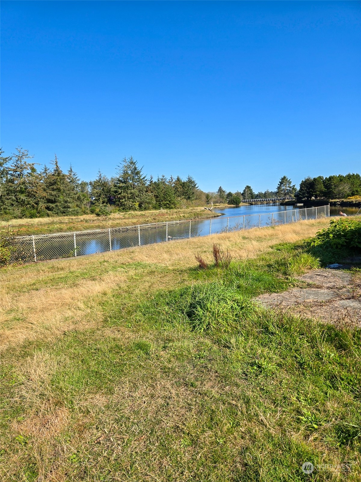 3137 Highway 109 Copalis Beach, WA 98535 - Photo 10 of 17 a view of a lake with houses in the back