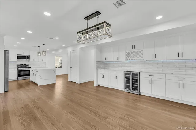 a view of a kitchen with electric appliances