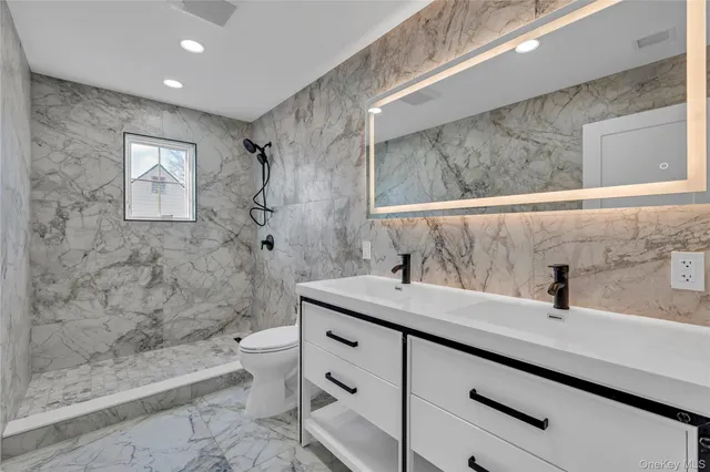 a bathroom with a sink a toilet and a bathtub