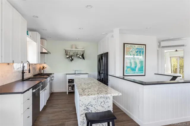 a bedroom with a large bed and a large window