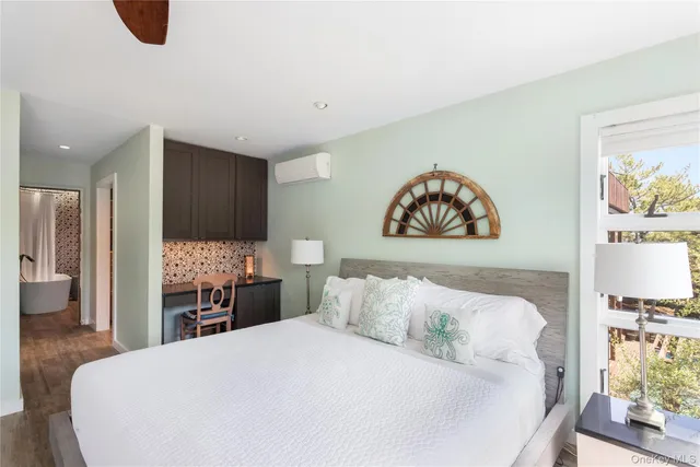 a bathroom with a sink toilet and a mirror