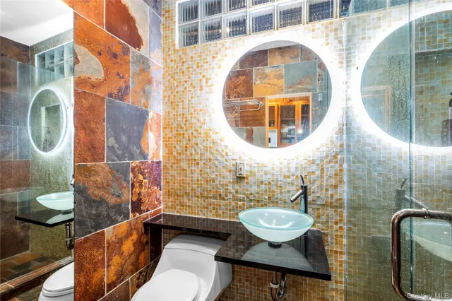 a view of a porch with a table and chairs and potted plants