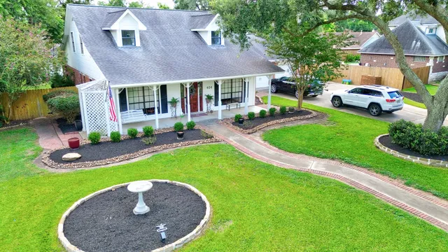 a view of a house with a yard porch and sitting area