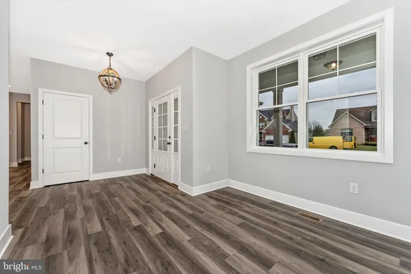 a view of empty room with windows