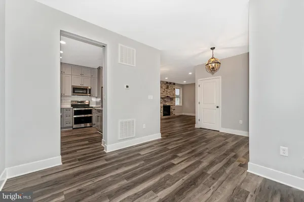 a view of a kitchen from the hallway