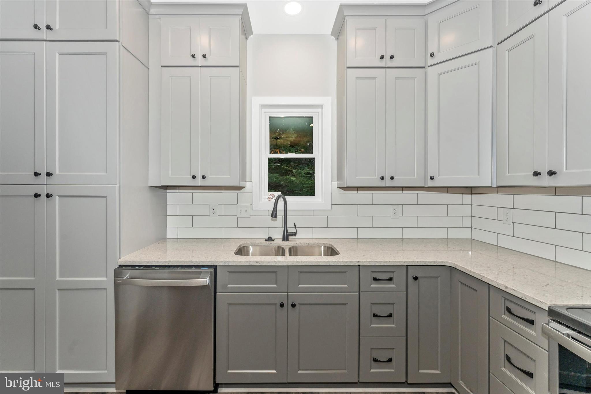 7792 Fairplay Road Fairplay, MD 21733 - Photo 23 of 45 a kitchen with white cabinets and sink