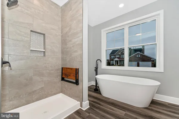 a white bath tub sitting in a bathroom