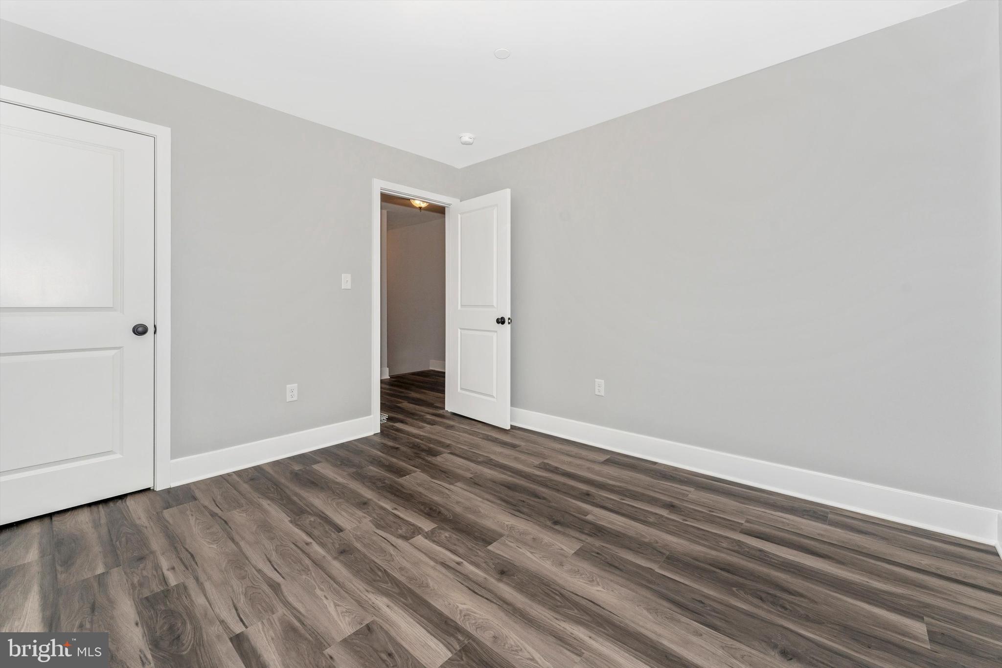 7792 Fairplay Road Fairplay, MD 21733 - Photo 42 of 45 a view of an empty room with wooden floor