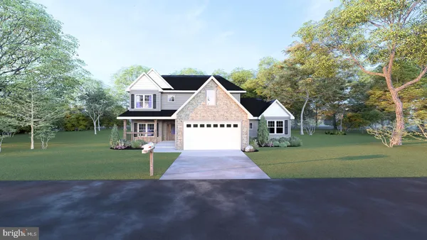 a front view of a house with a garden and trees