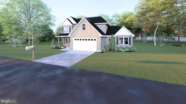 a view of a house with a yard and tree s