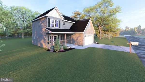 a front view of a house with a garden and yard