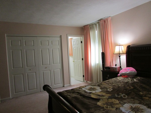 6 April Lane, Unit 15 Lexington, MA 02421 - Photo 10 of 13 a bedroom with a bed and a closet
