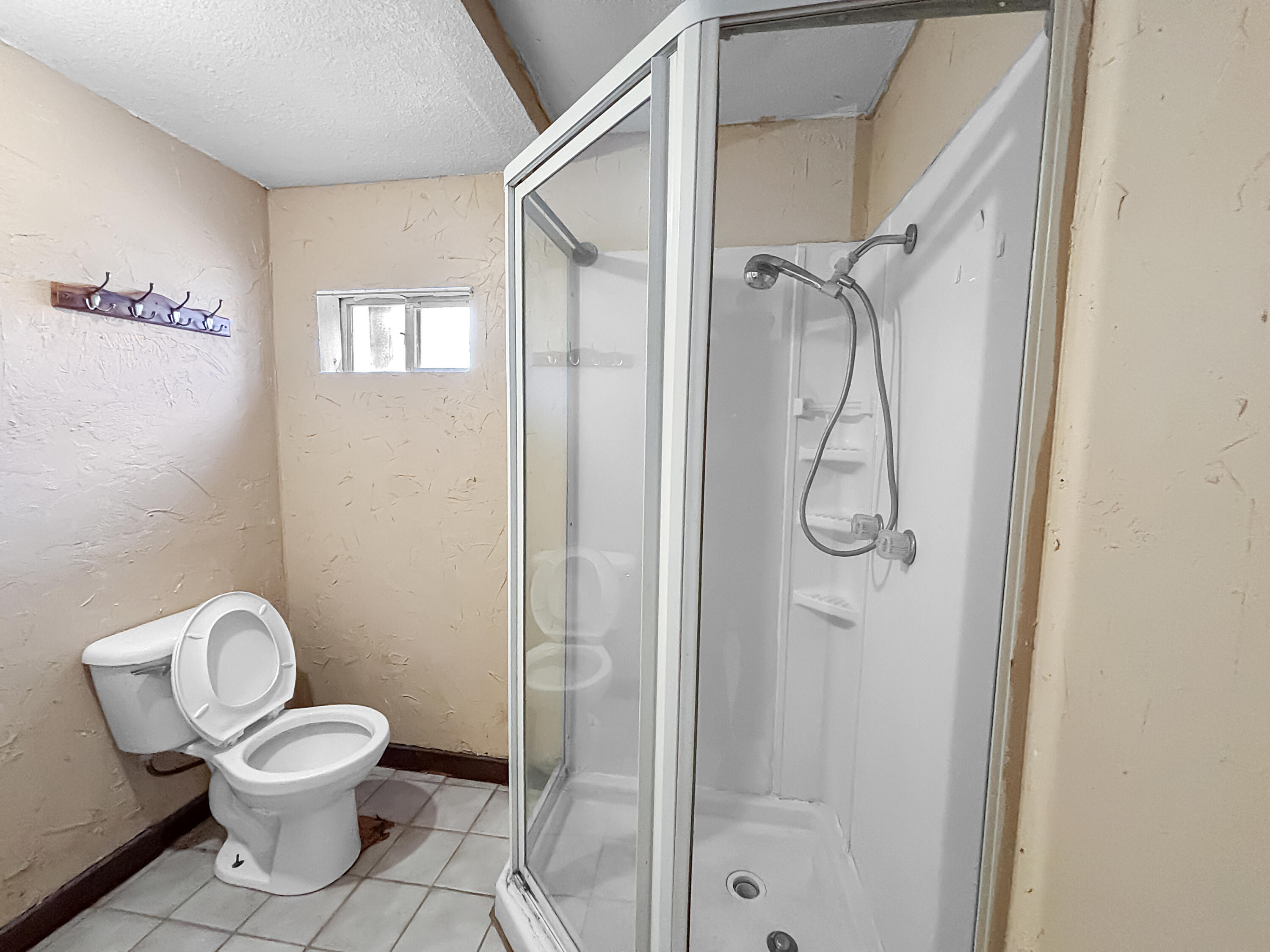 4411 45th Street Lubbock, TX 79414 - Photo 38 of 44 a bathroom with a toilet and a shower