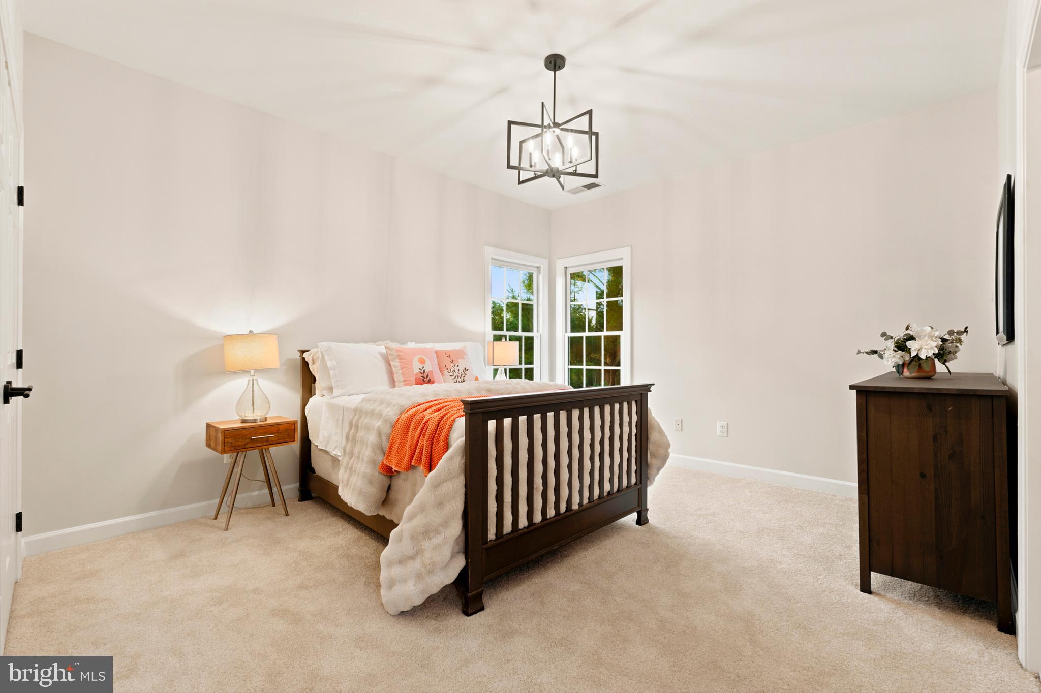 9313 Harrisons Farm Way Laytonsville, MD 20882 - Photo 42 of 77 a bedroom with a bed and a window