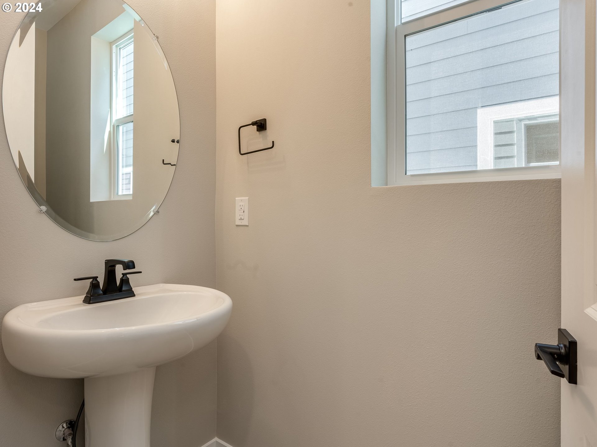 850 Northwest 178th Street Ridgefield, WA 98642 - Photo 20 of 48 a bathroom with a sink and a mirror