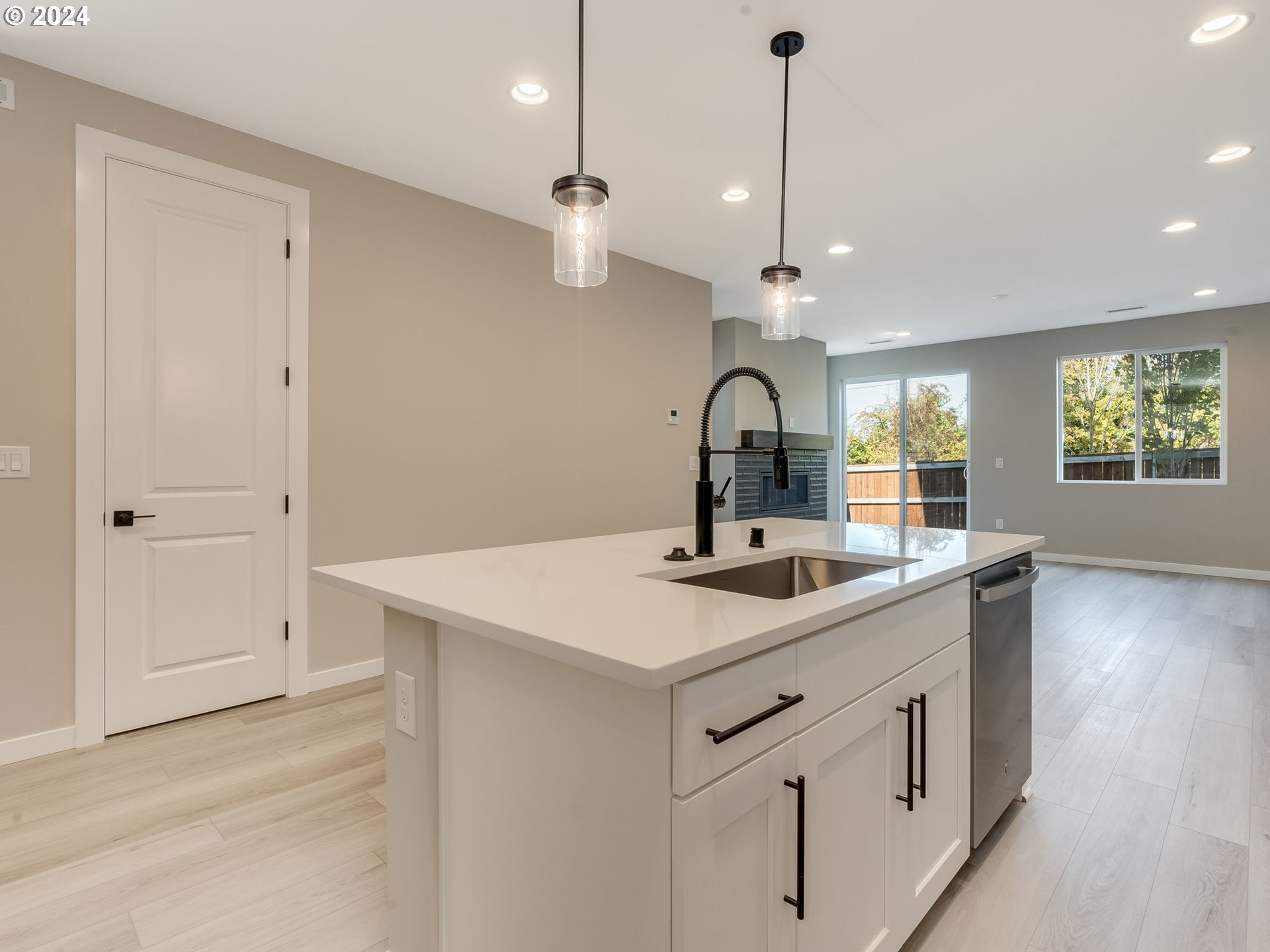 850 Northwest 178th Street Ridgefield, WA 98642 - Photo 3 of 48 a kitchen with a sink a counter space and stainless steel appliances