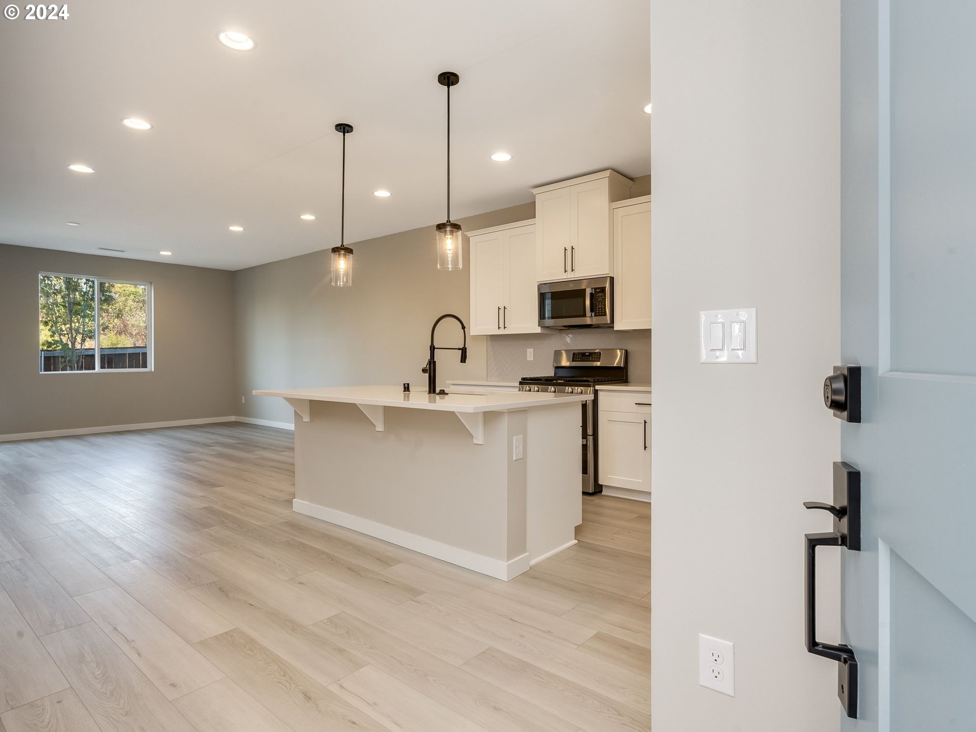 850 Northwest 178th Street Ridgefield, WA 98642 - Photo 6 of 48 a kitchen with kitchen island a sink stainless steel appliances and cabinets