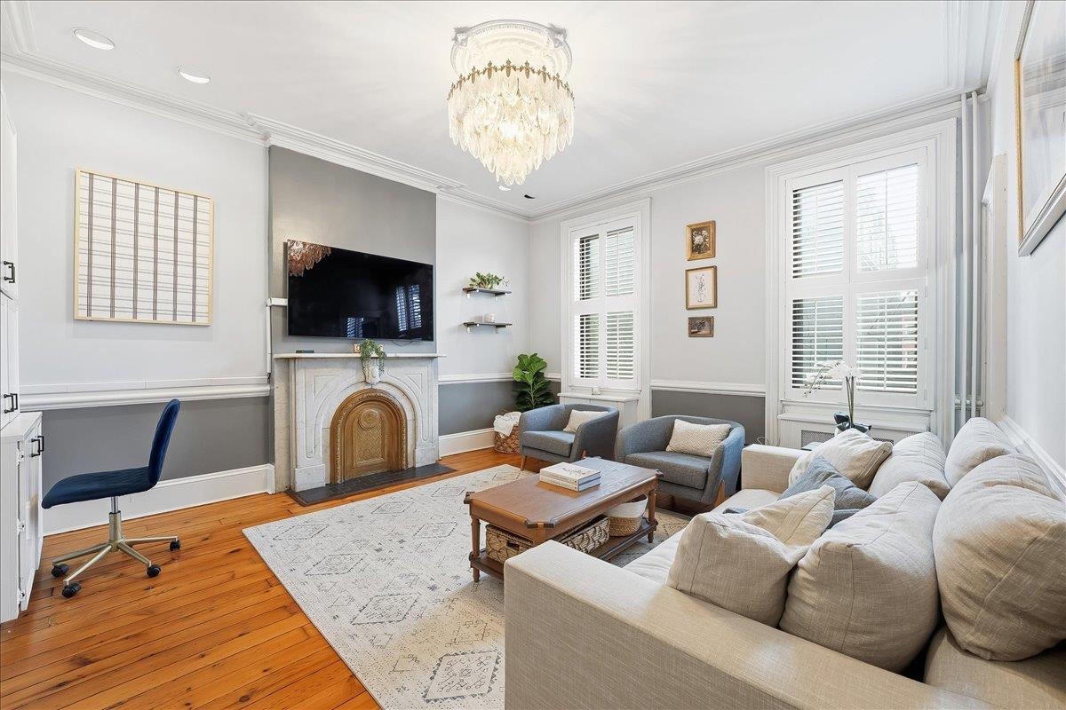 826 Washington Street, Unit 2 Hoboken, NJ 07030 - Photo 1 of 42 a living room with furniture a fireplace and a flat screen tv