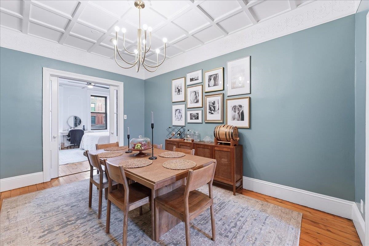 826 Washington Street, Unit 2 Hoboken, NJ 07030 - Photo 11 of 42 a view of a dining room with furniture wooden floor and chandelier