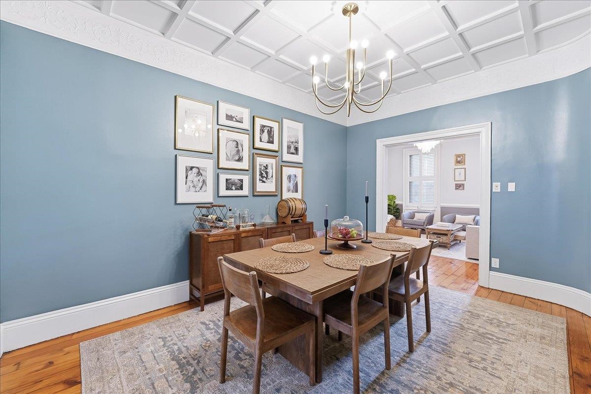 826 Washington Street, Unit 2 Hoboken, NJ 07030 - Photo 12 of 42 a view of a dining room with furniture a chandelier and wooden floor