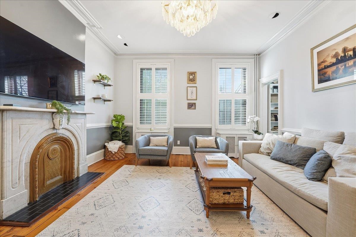826 Washington Street, Unit 2 Hoboken, NJ 07030 - Photo 2 of 42 a living room with furniture and a fireplace