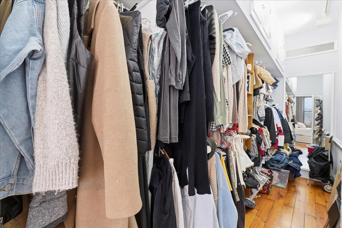 826 Washington Street, Unit 2 Hoboken, NJ 07030 - Photo 22 of 42 a view of walk in closet with clothes and shoes