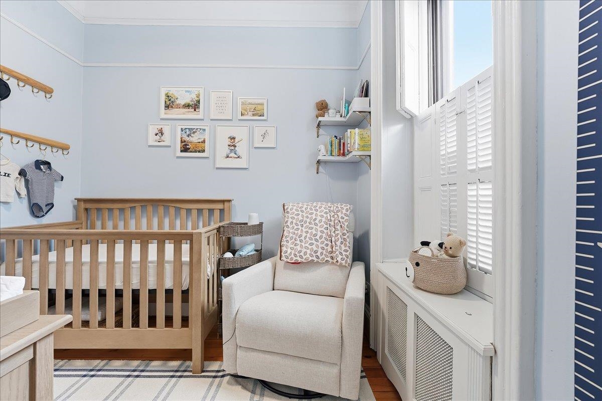 826 Washington Street, Unit 2 Hoboken, NJ 07030 - Photo 25 of 42 a bedroom with furniture and a window