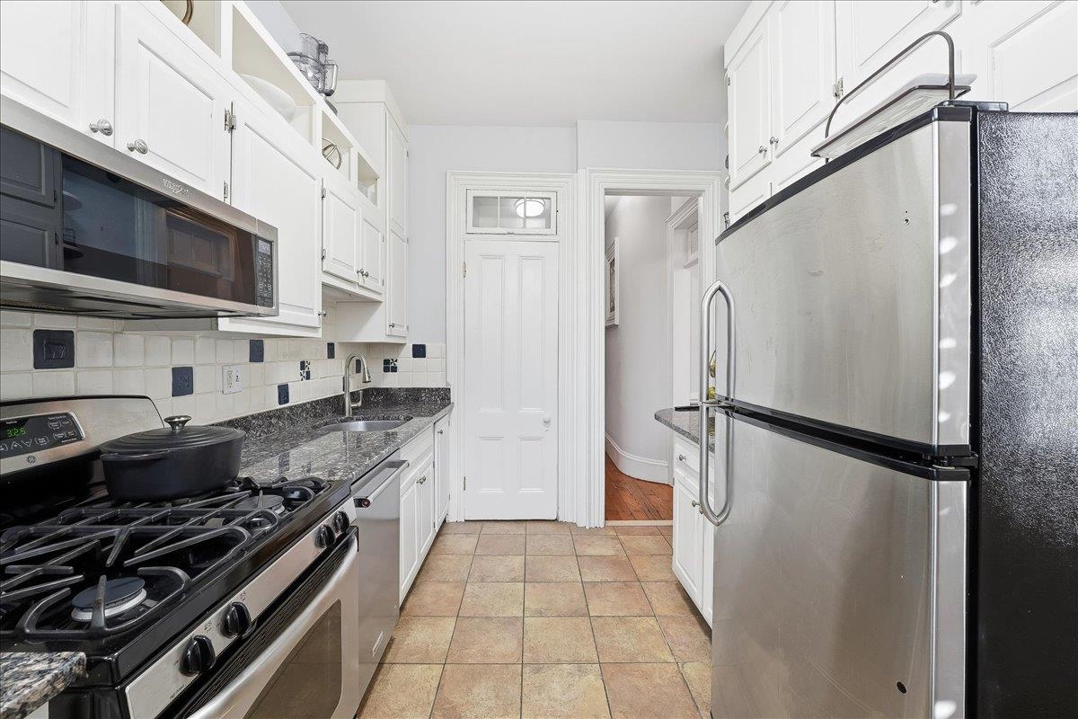 826 Washington Street, Unit 2 Hoboken, NJ 07030 - Photo 31 of 42 a kitchen with stainless steel appliances a refrigerator and a stove top oven