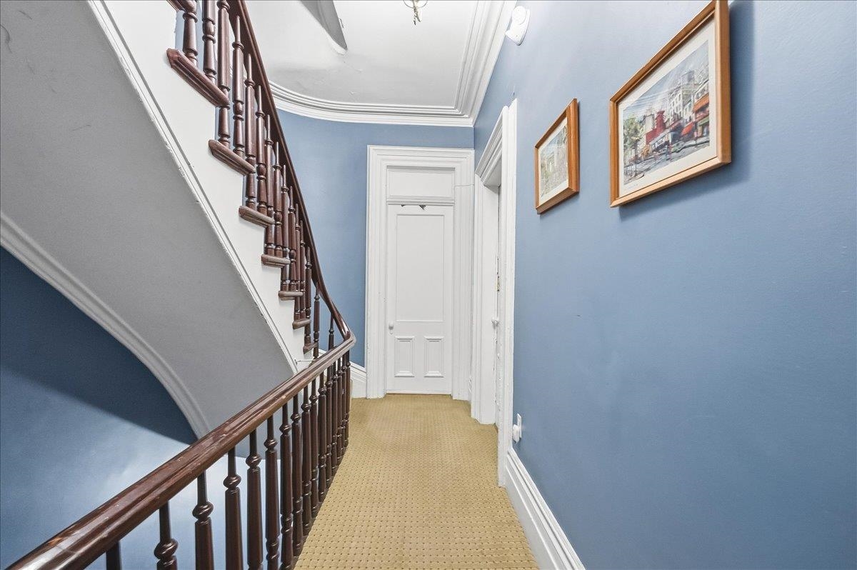 826 Washington Street, Unit 2 Hoboken, NJ 07030 - Photo 34 of 42 a view of staircase with wooden floor and white walls
