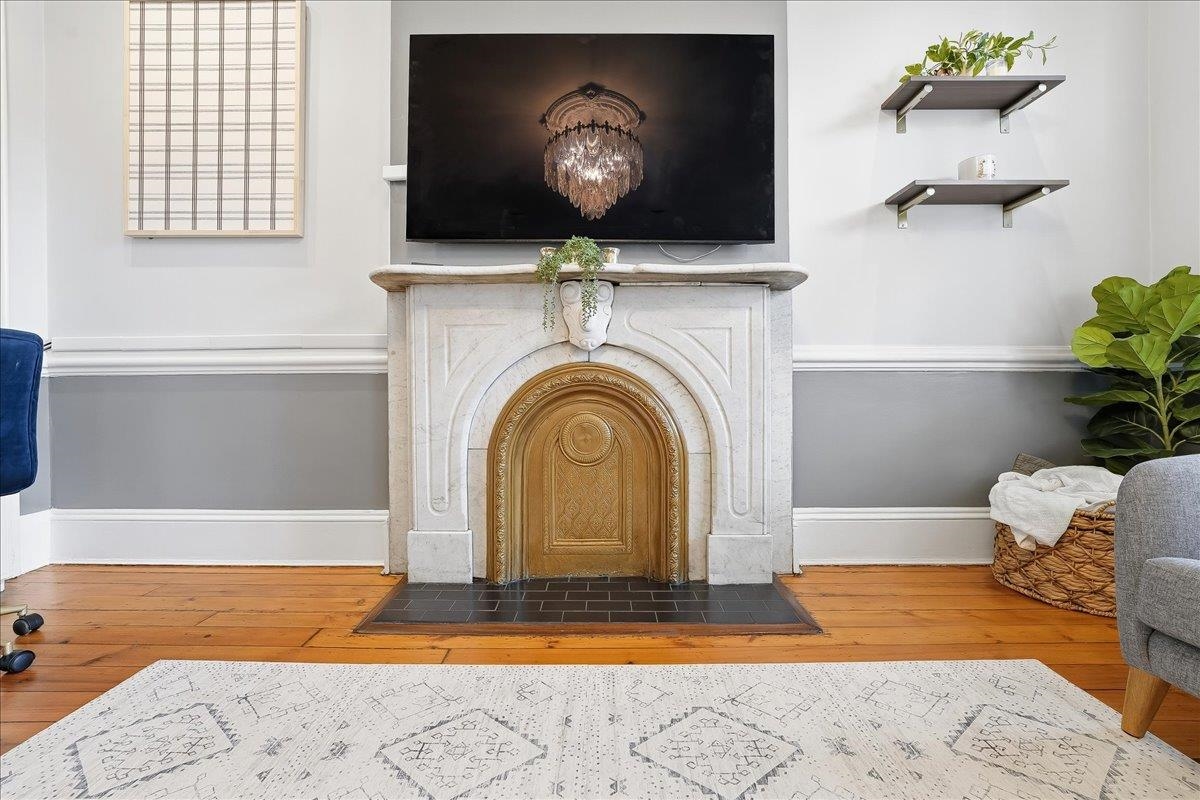 826 Washington Street, Unit 2 Hoboken, NJ 07030 - Photo 4 of 42 a view of living room with a fireplace furniture and a potted plant