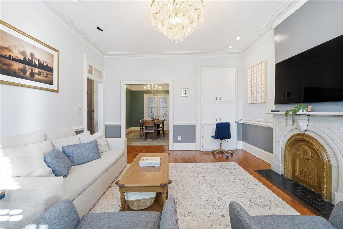 826 Washington Street, Unit 2 Hoboken, NJ 07030 - Photo 6 of 42 a living room with furniture and a flat screen tv