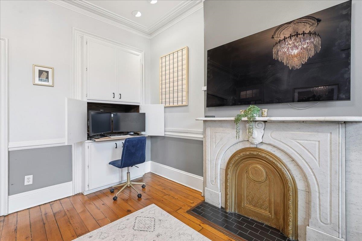 826 Washington Street, Unit 2 Hoboken, NJ 07030 - Photo 8 of 42 a living room with furniture and a flat screen tv