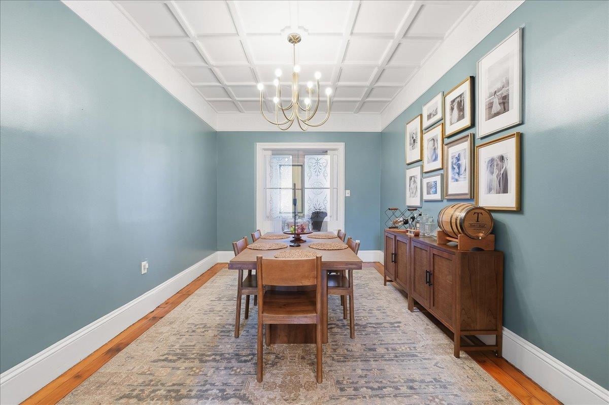 826 Washington Street, Unit 2 Hoboken, NJ 07030 - Photo 10 of 42 a dining room with furniture a chandelier and wooden floor