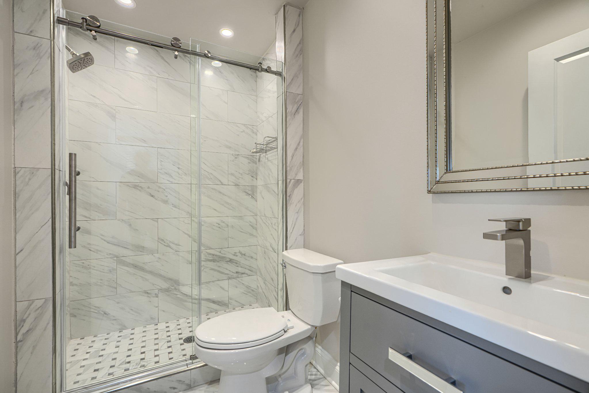 2707 Lady Slipper Road Gambrills, MD 21054 - Photo 51 of 60 a bathroom with a sink a toilet and shower