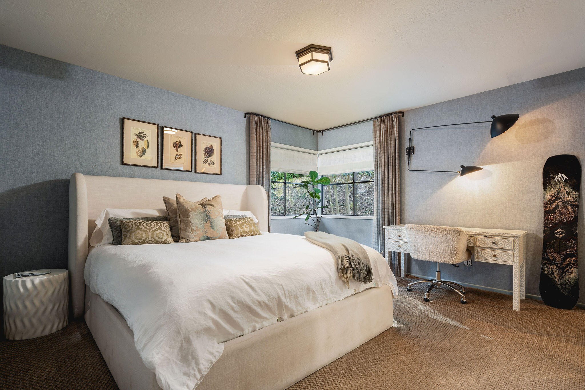 395 Woodley Road Montecito, CA 93108 - Photo 17 of 30 a bedroom with a bed a table and chair