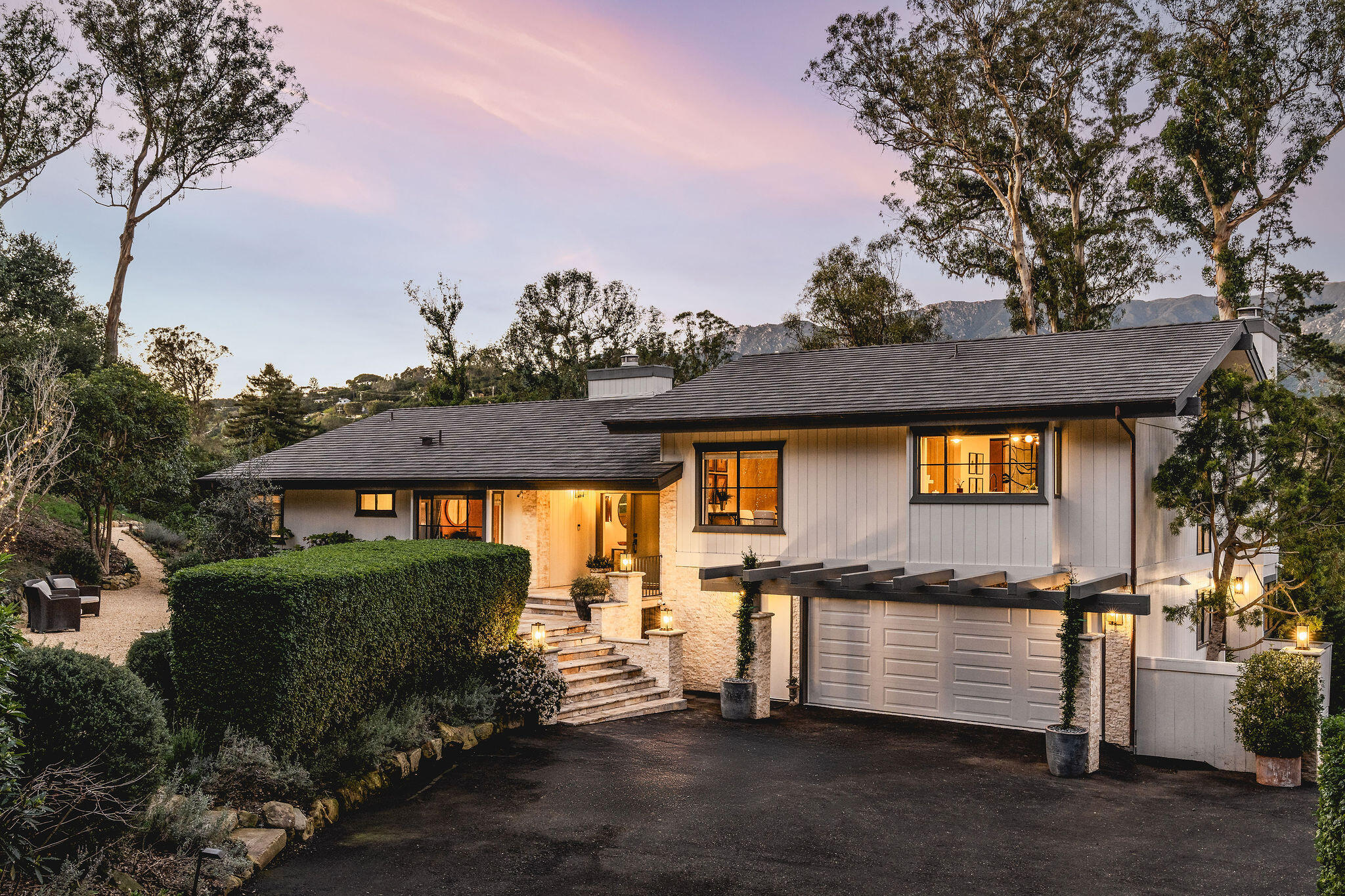 395 Woodley Road Montecito, CA 93108 - Photo 2 of 30 a front view of a house with a yard