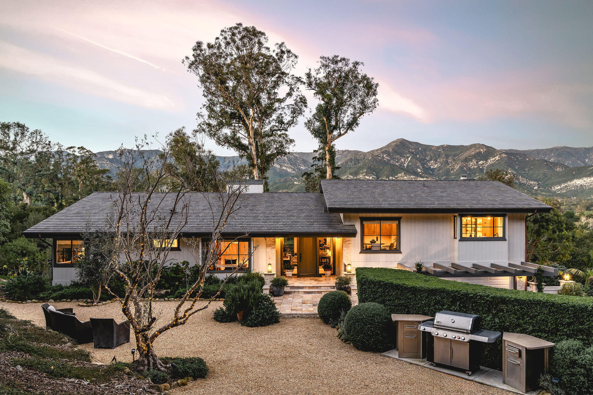 395 Woodley Road Montecito, CA 93108 - Photo 3 of 30 a view of a house with a backyard and a patio