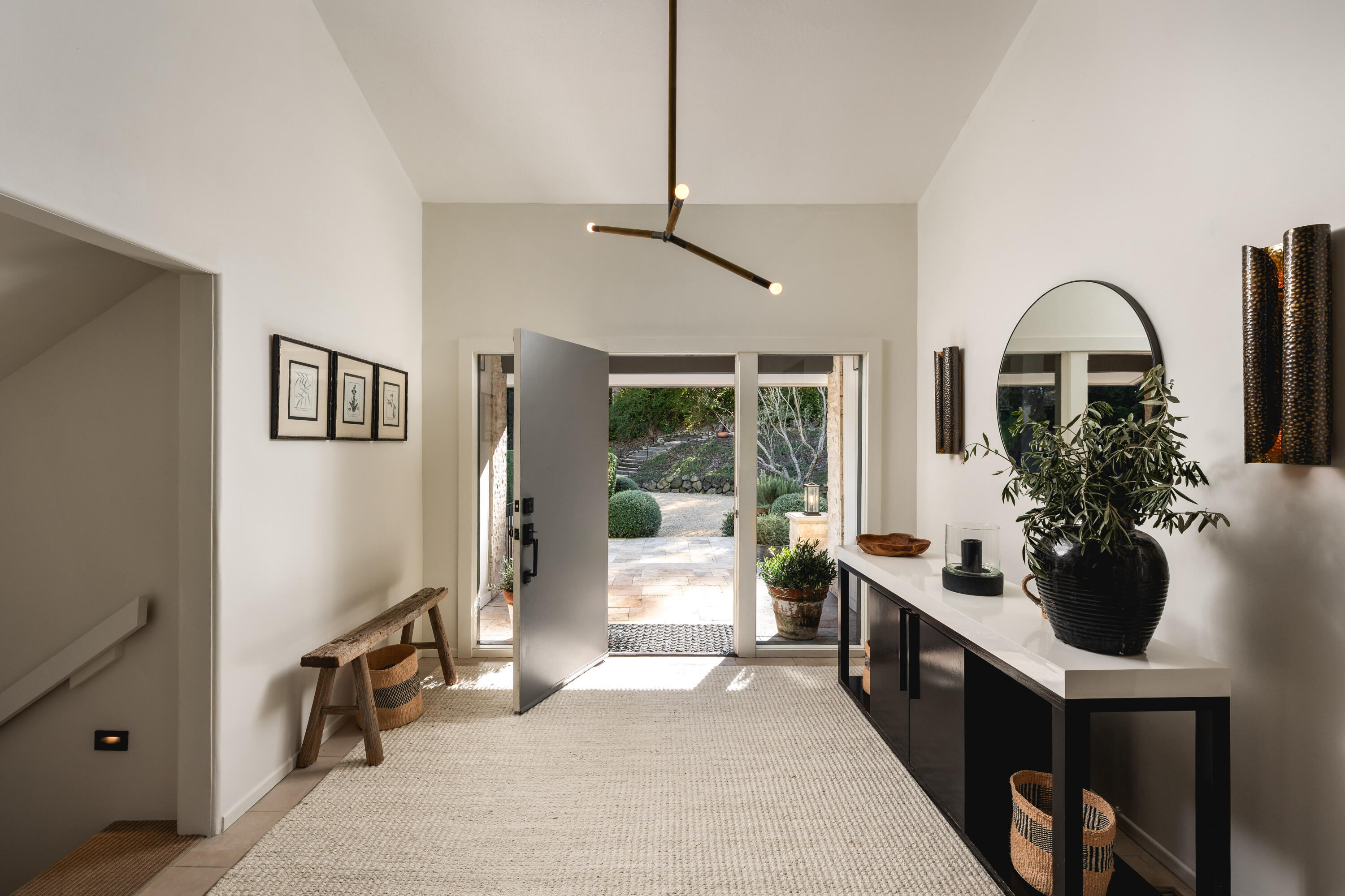 395 Woodley Road Montecito, CA 93108 - Photo 4 of 30 a living room with furniture a potted plant and a window