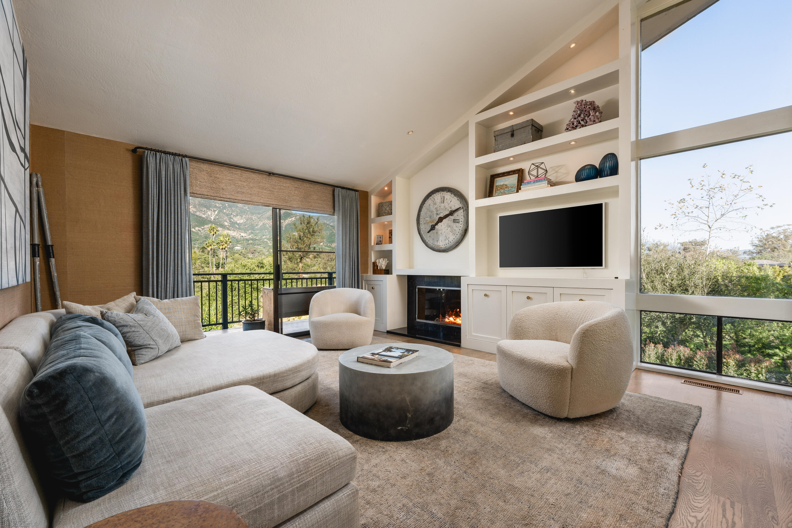 395 Woodley Road Montecito, CA 93108 - Photo 8 of 30 a living room with fireplace furniture and a flat screen tv
