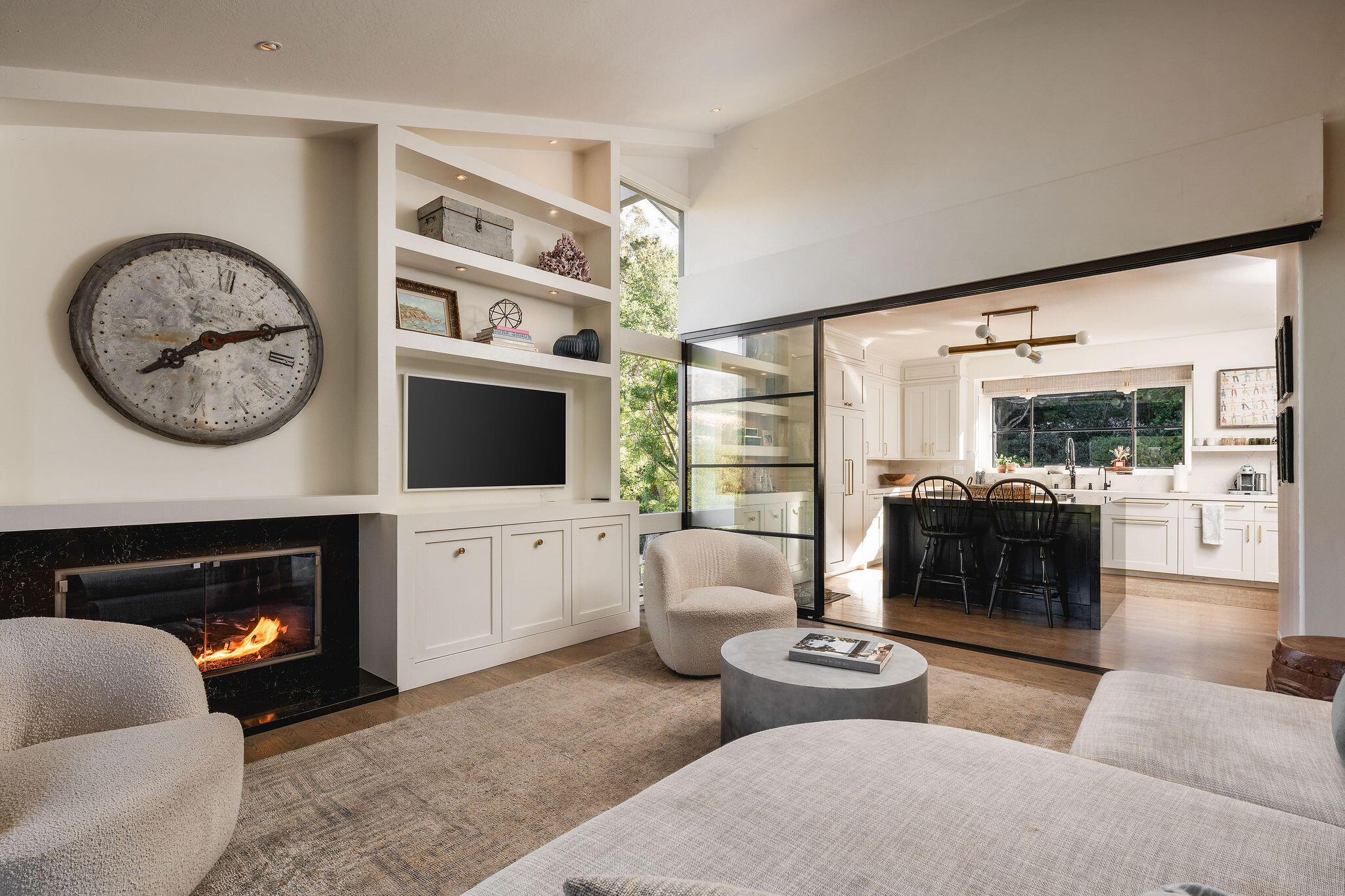 395 Woodley Road Montecito, CA 93108 - Photo 9 of 30 a living room with furniture a flat screen tv and a fireplace