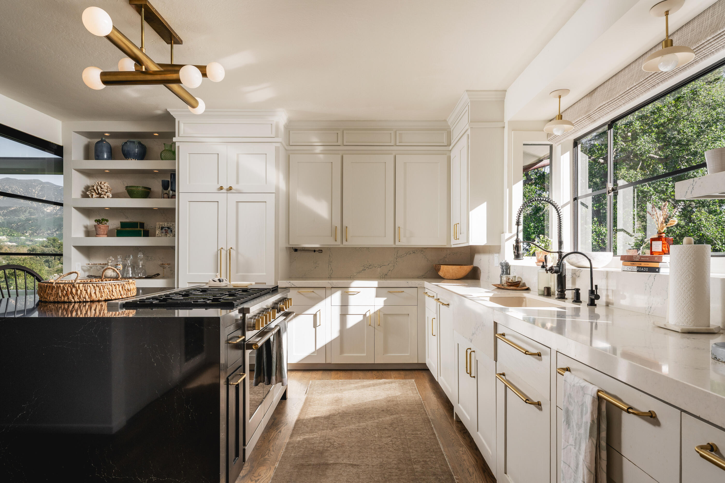 395 Woodley Road Montecito, CA 93108 - Photo 10 of 30 a kitchen with a sink stove and cabinets